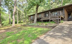 Enjoy summer mornings on the large deck or evenings on the back patio. Beautifully terraced yard allows for a serene and private feel. Spread out in this 1443 sq ft home with 3 bedrooms, 1.5 baths and an open concept floor plan. Large laundry room with access to the carport area. New flooring and paint throughout. New roof (30-yr architectural shingles) and AC in 2015