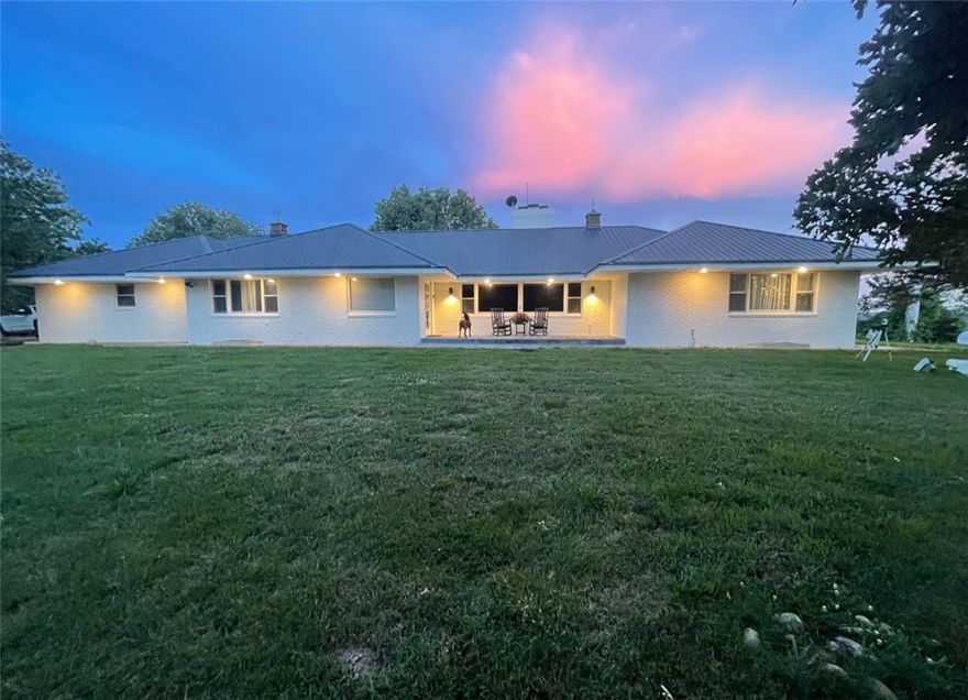 Tucked away near Bull Shoals Lake, this one-of-a-kind 6 bed, 4 bath home offers space, character, & timeless Ozarks charm. Built rock solid, the home features approximately 3,000 sq ft on the main level plus an additional 2,500 sq ft basement—providing room for entertaining, guests, hobbies, or flexible living space. Situated on 7.5 beautiful acres with large mature trees & inviting patio areas, the setting feels peaceful, private, & perfectly suited for lake living. Whether you’re enjoying your morning coffee under the shade trees or gathering with friends after a day on the lake, this property was made for making memories. Local lore says none other than Ellie May Clampett once lived here, adding unforgettable personality & history to an already remarkable home. If you’ve been searching for acreage, square footage, & true character near the lake, this one delivers. Also listed with the shops across the street in MLS#1337833