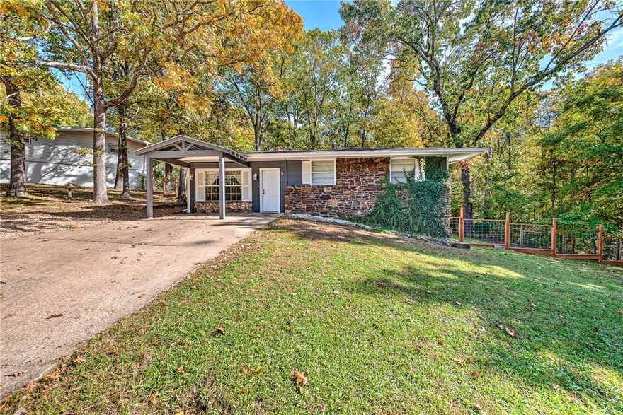 Welcome to 5 Pershore Lane in beautiful Bella Vista! This charming 3-bed, 2-bath home offers 1,560 sq ft with modern updates throughout. Enjoy Corian countertops, energy-efficient windows, fresh paint, and a spacious living area that opens to a large deck, perfect for relaxing or entertaining. Primary suite and two guest bedrooms provide flexibility for family or home office use. Located in the Bentonville School District near the Back 40 Trails and Town Center. Property is on the Village Waste Water sewer-connection list; buyer will be required to connect within 90 days of closing.  Buyer credit for sewer connection available with a reasonable offer. Move-in ready and full of Bella Vista charm!