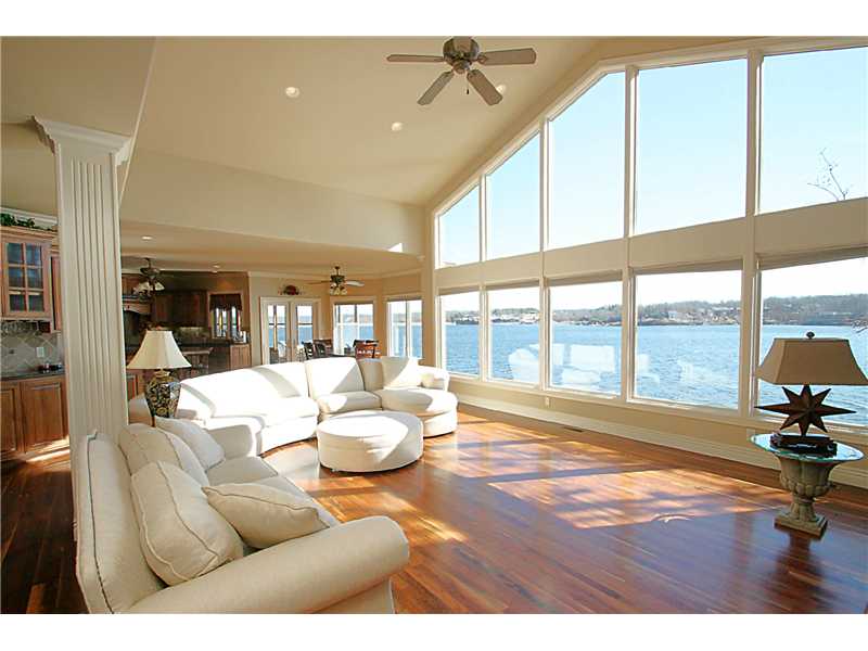 UNBEATABLE LAKE VIEWS-- Immaculate custom built 6,515sf 4 bedroom, 3 bath home situated on 0.46 acre lot overlooking Lake Loch Lomond 20' to the water! Beautiful hardwood floors, granite counters, huge kitchen w/stainless appliances,(double ovens, warming drawer & more), private boat dock w/lift, 27x14 screen porch, media room, 2nd living & kitchen area downstairs. Stunning views of lake from every room in the house!