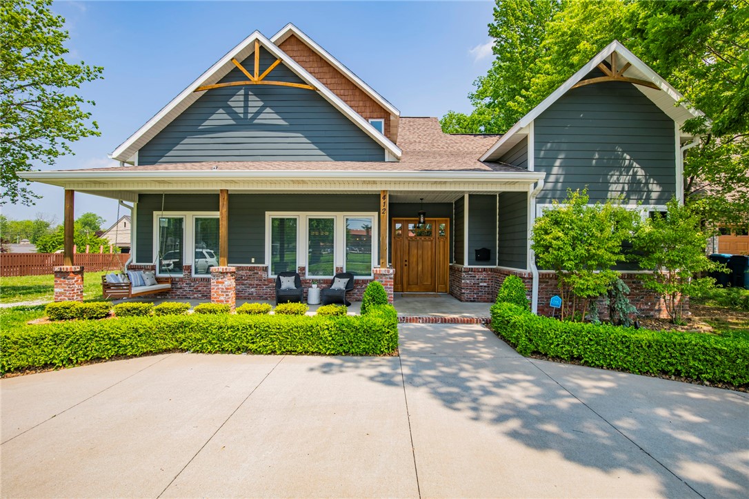 This gorgeous metropolitan custom home is a perfect blend of luxury and functionality, and has all an active family needs. With over 4900 SF of living space, a 4 car garage (including an electric charging station, built in cabinets and plenty of room to store bikes!), private outdoor entertainment area, open floor plan and a huge game room with pool table, wet bar and dishwasher, there's plenty of room to spread out. Beautiful designer finishes throughout, it has a contemporary feel accentuated by elevated windows that allow for plenty of light but placed to also allow privacy. The master suite includes a large bedroom, bright en-suite bathroom with a soaking tub and a safe room in the master closet with space to store necessities just in case. The outdoor entertaining area includes a grilling area, hot tub, and plenty of covered sitting areas warmed by infrared heaters and TVs for year-round livable space. Just blocks from downtown Bentonville - a mere 9 minute walk to the square!