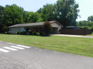 Living is easy in this updated, 3 bedroom, 1 1/2 bath home conveniently located with an elementary school just across the street as well as grocery stores, shops, and restaurants a minute away. A privacy fence adds an extra layer of seclusion while you enjoy relaxing gatherings outside on the covered patio and watch the children explore the expansive playground set. Laundry chores will be more enjoyable in the large, airy utility room with multiple windows.