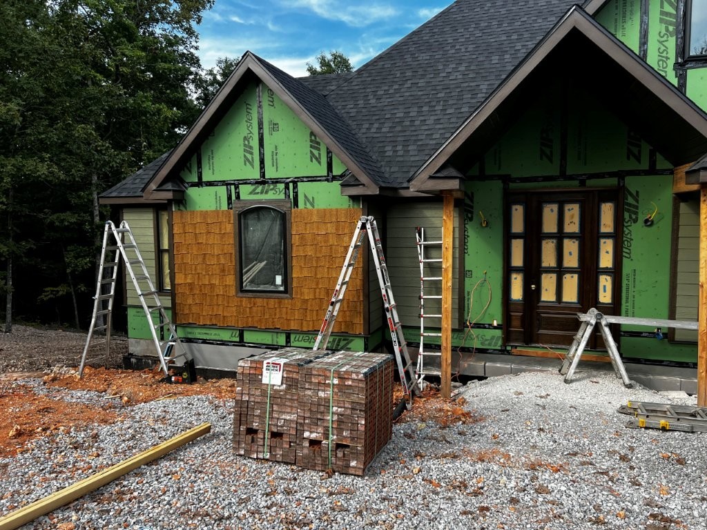 New Construction home on a spacious 3.048 acre lot! This 4 bed, 4 bath home is a stunner. The builder put their heart into this home, ensuring the floor plan is outstanding and the building materials and finishes are top notch. Featuring a split floor plan, two levels of deck/patio space, including a screened-in deck with a fireplace. A smart closet, safe room, workshop with wide doors for easy entry, and a mechanical room are just some of the features this home offers.