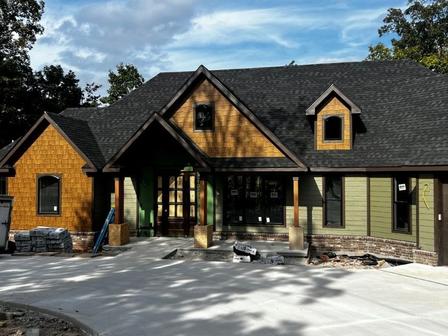 New Construction home on a spacious 3.048 acre lot! This 4 bed, 4 bath home is a stunner. The builder put their heart into this home, ensuring the floor plan is outstanding and the building materials and finishes are top notch. Featuring a split floor plan, two levels of deck/patio space, including a screened-in deck with a fireplace. A smart closet, safe room, workshop with wide doors for easy entry, and a mechanical room are just some of the features this home offers.
