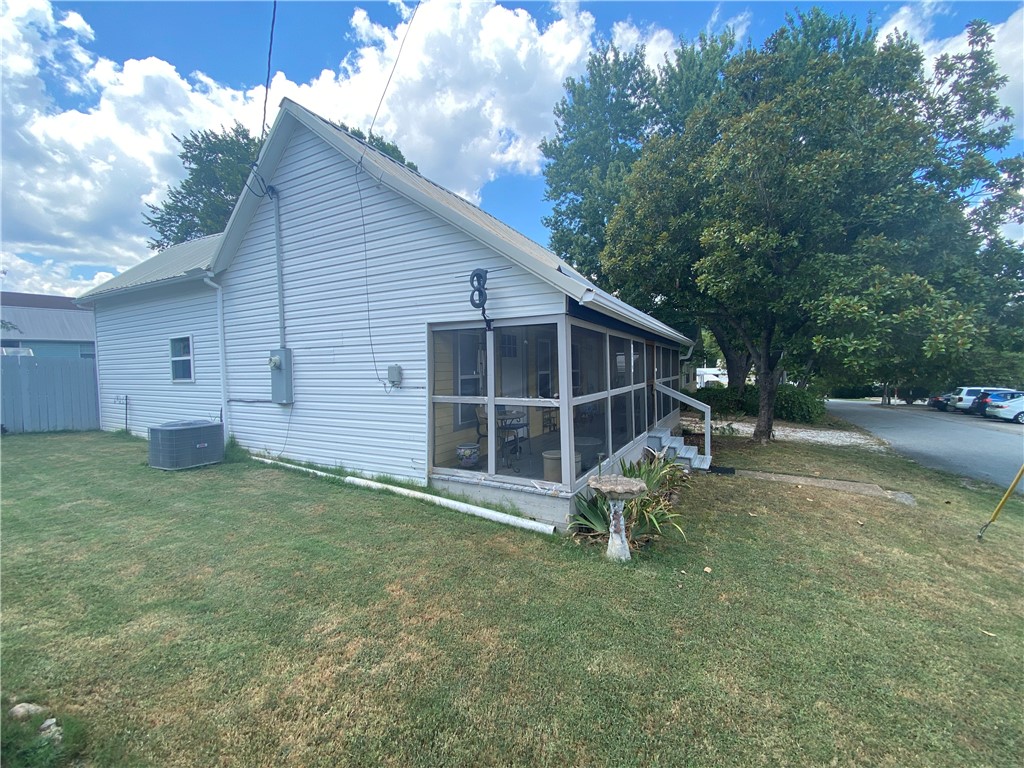 This 986 SF, 2 BR, 1 BATH home (in great condition) is located in the quaint town of Jasper, Arkansas near the Little Buffalo River in the Ozark Mountains & Buffalo National River Region of Newton County Arkansas. This home is within walking distance to the historic Jasper Square (eating, shopping, services), Bradley Park (on the Little Buffalo River, pickle ball, swimming) and Jasper School. Fenced in back yard (privacy fence), nice deck on the back and full screened in porch on the front of the house. Laminate floors throughout with less than 5 yr old HVAC. Outside features include a detached carport, storage building and deck walkway. It is located in beautiful Newton County, Arkansas and near the Ozark National Forest. Property is just a short drive from Russellville, Harrison, and Fayetteville. This central location is convenient to the best swimming holes, hiking, canoeing, wildlife photography and fishing. Other nearby outdoor activities include horseback riding, mountaineering, caving, and scenic driving.