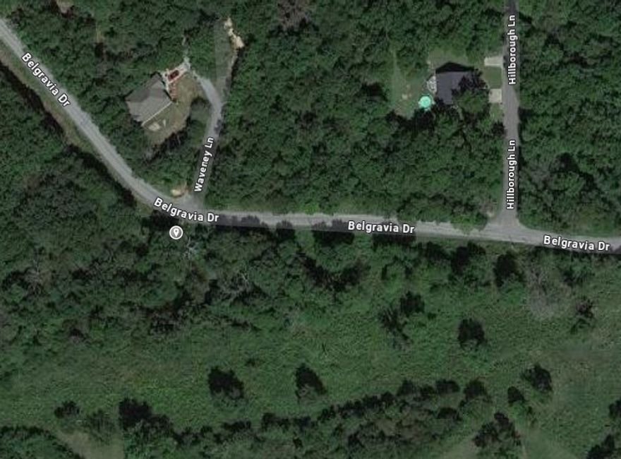 Discover serenity on this .25-acre wooded lot on Belgravia Dr., located within the Bentonville School District. With no neighboring lots on either side, this property offers unmatched privacy and the perfect setting for your dream home. Embrace peaceful living in a secluded, natural environment.