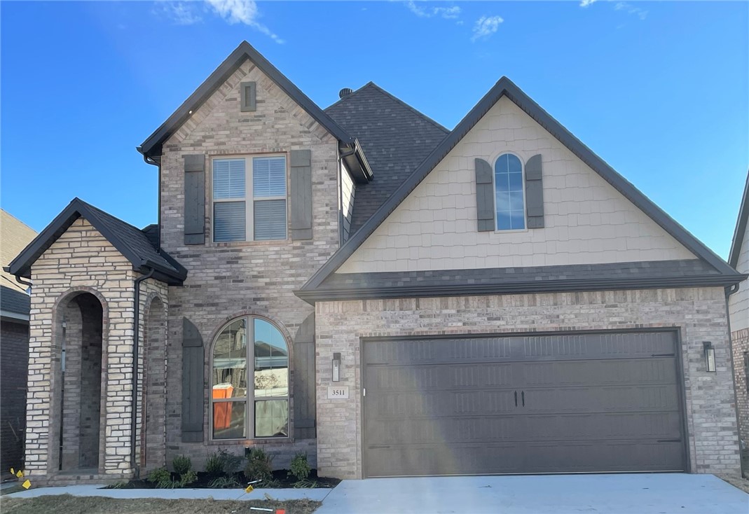 North facing house located in Aurora neighborhood. The home features 4 bedrooms 3 bathrooms with an open layout with large living room with fireplace and French doors leading to a covered patio with an outdoor fireplace. The kitchen features a gas range with a vented hood, a pantry, and a large granite island. First floor primary suite, featuring a vaulted ceiling and a luxurious private bathroom with double vanity, soaking tub, walk-in shower, and walk-in closet. Additional second bedroom downstairs, and two spacious bedrooms upstairs, each with walk-in closets.