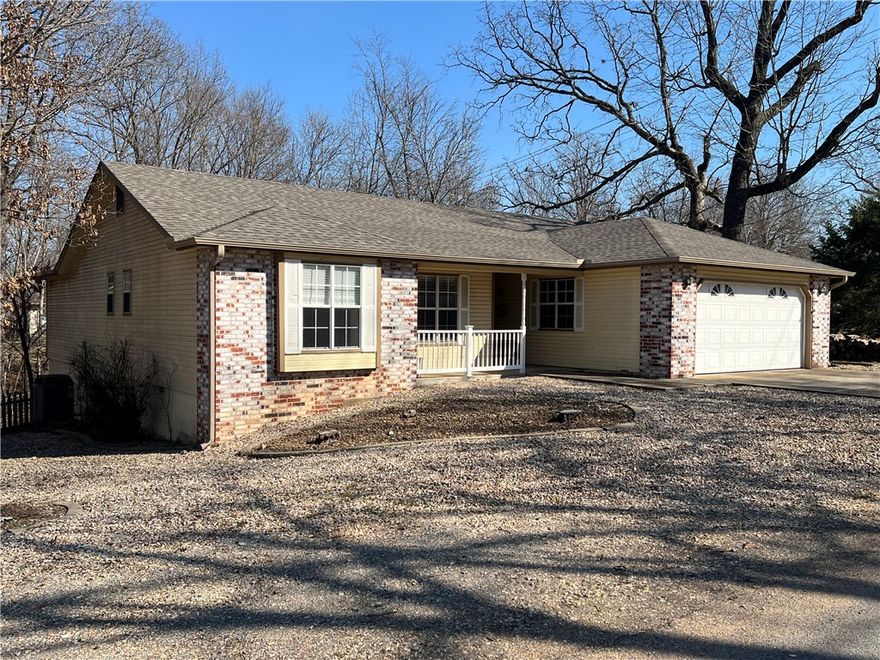 Outstanding price and location, new roof and gutters, very well maintained on corner lot with level driveway! Rare opportunity at this price point, perfect for first-time buyers or investors, right in the heart of town. Move in and update on your schedule and budget to make it your own! Convenient to Bella Vista's world-class bike trails, lakes, golf courses and other amenities along with shopping and dining. 3 bedrooms, 2 full baths, open floor plan, wood burning stove and good storage including 2 primary bedroom closets. Professionally landscaped, low maintenance all rock yard, composite deck and fully fenced back yard. What are you waiting for?