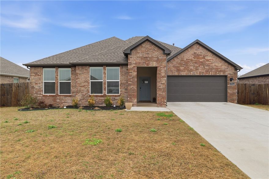 Built in 2023, this 4-bedroom, 2-bath home offers a bright, open layout with the kind of finishes buyers are asking for right now. The kitchen is truly the heart of the home, featuring a large quartz island, stainless steel appliances, subway tile backsplash, generous cabinet space, and a walk-in pantry. It opens seamlessly to the dining area and living room, where a fireplace adds warmth and character to the space.
The primary suite is spacious and inviting, with dual vanities, a large tiled shower, and a walk-in closet. Throughout the home, you’ll find durable LVP flooring, updated lighting, and a clean, modern feel.
Out back, the covered patio and fenced yard provide plenty of room to relax, entertain, or let kids and pets play. With a thoughtful floor plan, stylish finishes, and move-in ready condition, this home offers comfort, function, and everyday livability.