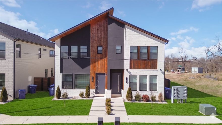 Enjoy the ultimate NWA lifestyle in this sophisticated townhome, located just 2.1 miles from the new Walmart Campus. Very close to the Square, world-class art, and renowned trails while avoiding the heavy traffic.

Interior Highlights:

Sophisticated Living: Open layout with 12-foot ceilings, linear tile fireplace, and accent lighting.
Chef’s Kitchen: Waterfall island, quartz counters, appliances, and a functional working pantry.
Primary Suite: Private retreat featuring wood floors and a spa-style bath with rain head/jets.
Flexible Layout: Main-level secondary bedroom plus an upstairs bonus living room for entertaining.