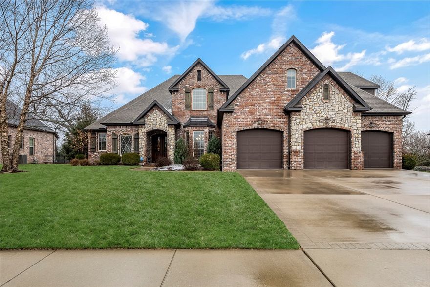 Welcome home to custom built luxury in the desirable gated Oak Tree community!  This spacious home boasts 5 bds, 3.5 bth and an amazing private wooded backyard oasis. Custom cabinetry, granite countertops, chef's appliances and attention to detail awaits. Formal dining room, office, large bedrooms, mudroom, a huge bonus room upstairs, and storage galore! Everything is perfect and move-in ready! There is unfinished space to expand!  Ready to entertain?  This is the backyard for you!!  The gunite salt water pool is surrounded by immaculate landscaping and trees, making it the perfect private getaway right at home!  Take advantage of the built-in grill and dine al-fresco or cozy up next to the outdoor fireplace under the covered patio. Need more? Grab some marshmallows and head out to the fire pit for the evening. Oak Tree invites you to take advantage of all their amenities, too!  Tennis, pickleball, community pool and playground and a clubhouse! This amazing home is everything you've been looking for in NWA!