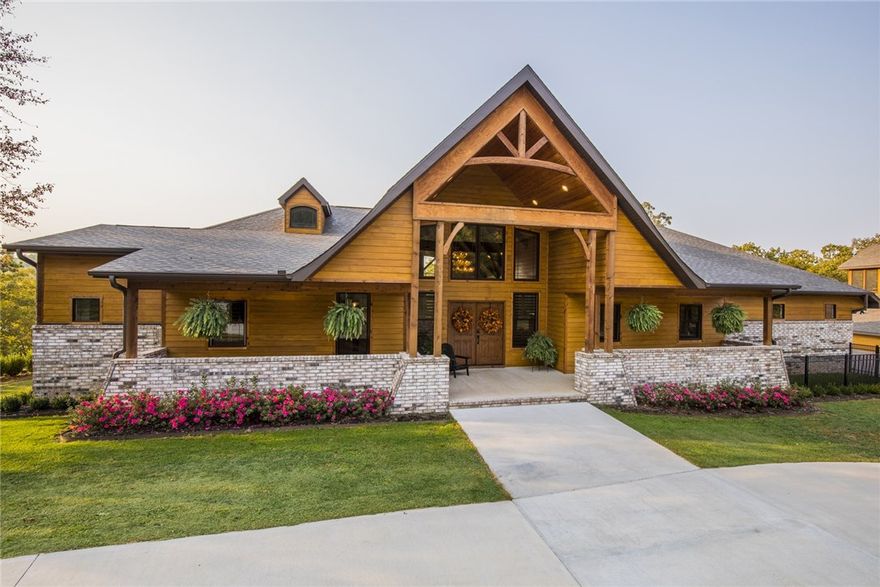 This 2018 custom Craftsman style Smart-Home on 2.49 acre estate in a gated community overlooking Beaver Lake includes 2018 Bennington tritoon w/lift & highly coveted boat slip at Prairie Creek Marina, less than 10 minutes away! You’ll have plenty of room to spread out in the 4 bedroom main house & relaxing apt over the matching barn. 
The spacious open floor plan includes high-end finishes w/wide plank hickory floors throughout. Expansive double paned windows & patio doors frame beautiful water views.  
Main floor bedrooms have private deck access. The gourmet eat-in kitchen cabinets complement the marble countertops, Delta pull-down touch faucets & Frigidaire  Professional stainless appliances. 
The barn contains air-controlled shop & 1/2 bath downstairs w/screened-in porch, and parking or storage for RV, boat/trailer or toys.  
Come & see all of the special touches. 
All appliances & furnishings included.