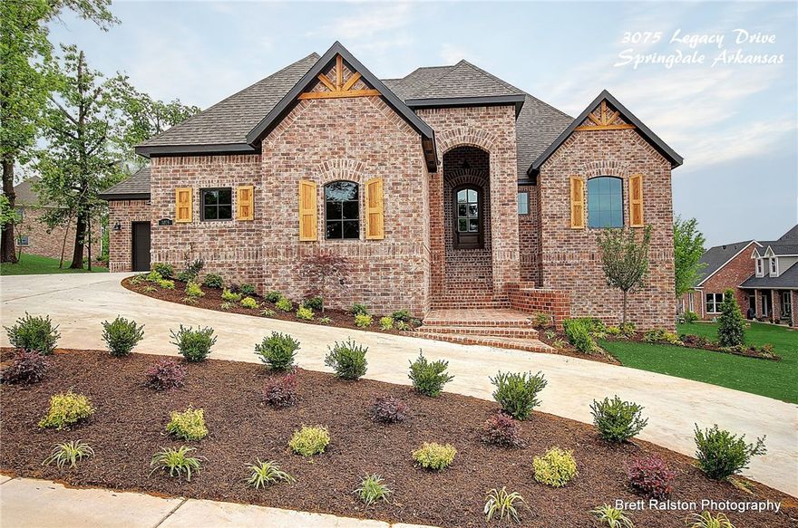 This beautiful 5BR 4.5BA home in Heritage Hills gated S/D is complete with handcrafted wood ceiling in kitchen, granite counter, custom built in coffee espresso maker, SS appliances,2 utility rooms, full basement w/media/game room, 2BR, storage, kitchen, & gym w/mirror wall. Outdoor fireplace, & full privacy fence Plus over 913 SF of additional heated storage space not included in listed SF. Sod, Landscape/Irrigation Pkg. On large lot. 
Directions: I49-E on Don Tyson/S on Carley/E into Heritage Hills S/d