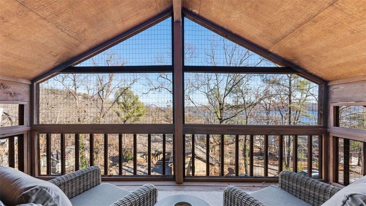 Lake retreat on a spacious 0.75 acre lot perfect for your personal home, investment and/or AirBNB! With seasonal lake views, multiple decks and nearby boat ramp, this Lost Bridge property brings the serenity of nature home. Walk into a large, open living space with beautiful, wood-burning fireplace & updated kitchen. The primary bedroom with updated bath, including heated floors, is located on the main level. Upstairs is a private bedroom & bath plus an office or bonus area that leads right out to your own cozy, covered deck. The finished, walkout basement has a rec/mudroom with full bath and an additional bedroom/bonus room with pellet stove for those extra chilly nights! The oversized, heated & cooled 3-car garage with half bath has more than enough room for all the toys (plus shed). Community amenities include pool, gym & pickleball courts! Metal roof- 2016; SS appliances- 2019; water softener. Kitchen/garage refrigerators, Ring security system, and washer & dryer to convey.