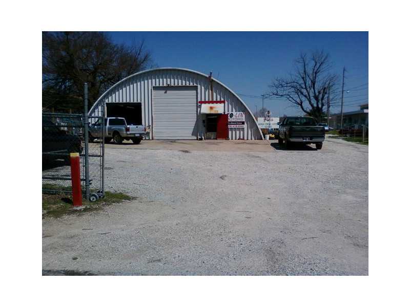 Two Lots with all utilities and 2 car bay service area, hydrol lift on one bay. Chain link fence around both lots. Currently being rented. Building is heated.