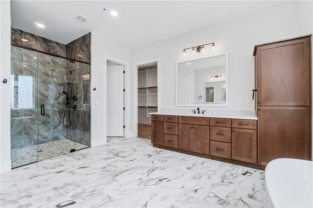 Indulge in elevated living with this one-story, 4-bedroom, 3.5-bath home in the prestigious Big Sky subdivision, which redefines elevated comfort. Featuring top-of-the-line finishes, a chefās kitchen with premium appliances, and an open-concept design, every detail speaks to modern luxury. Selections hand-picked to enhance the design of the property. The primary suite offers a spa-like retreat with a soaking tub, walk-in shower, and dual vanities, while additional bedrooms provide space and versatility. With smart-home features, a 3-car epoxy-finished garage, and elegant outdoor living, this residence delivers the perfect blend of sophistication and ease in Northwest Arkansas.
