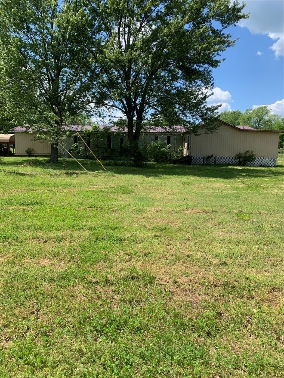 Nice big doublewide with lots of room , sitting on 2.93 acres. Large laundry room, kitchen and dining area, with Master bedroom just off the living area that has extra room for office, nursery or large storage space/closet. Two portable carports, large shop building and storage building. Older mobile seller used for storage as well. This place has lots of room inside and outside. Seller has never smoked in the house and has never had animals.