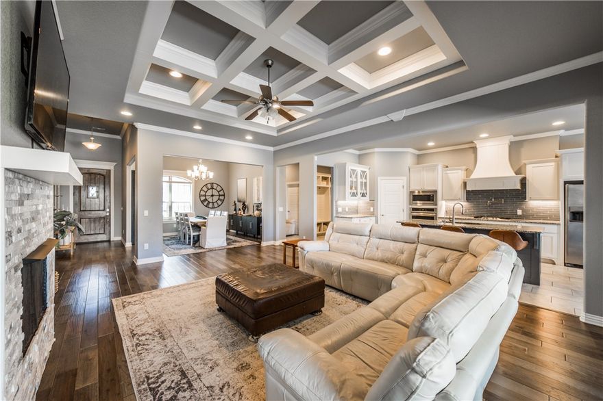 Welcome to your family's dream home! This spacious and thoughtfully designed one-story residence offers everything your growing household needs. 4 bedrooms, 3 bathrooms, formal dining room, eat in kitchen, large laundry room with sink, 3 car garage, large drop zone and covered patio. Step into the bright, open-concept living and kitchen area where oversized picture windows fill the space with natural light, and charming built-ins and a coffered ceiling adds character and warmth. It’s the perfect setting for movie nights, birthday parties, or just relaxing together after a long day.
The heart of the home—the kitchen—is equipped with custom cabinetry, a vented hood, under-cabinet lighting, and a 5-burner gas cooktop. The split floor plan provides privacy and space for everyone, with oversized bedrooms that give kids and guests room to spread out. The serene primary suite offers a peaceful retreat for parents.
This home checks all the boxes for active, modern family life—don’t miss your chance to make it yours!