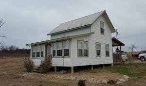 Cute 1 1/2 story home on almost 7 acres; great view! mainly pasture; has pond; large covered deck; some fencing for a horse or cow; hard to find for this price.
