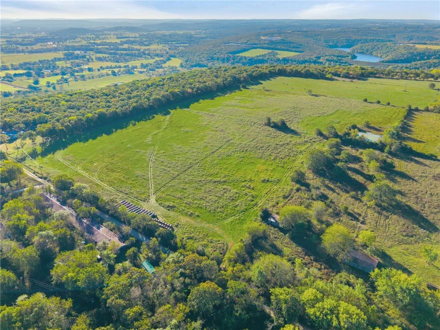 27.5 Beautiful, flat ridgetop Acres tucked away for privacy. Located North of Lincoln Lake, the view from this ridge is breathtaking. Established pasture/hay ground with a spring fed pond, makes this ideal for livestock, recreation or for building the perfect homestead. The land is fully fenced, and all utilities are available at the road. This property has access from both Jackson Hwy and Hunton Lane. Schedule your showing today!
