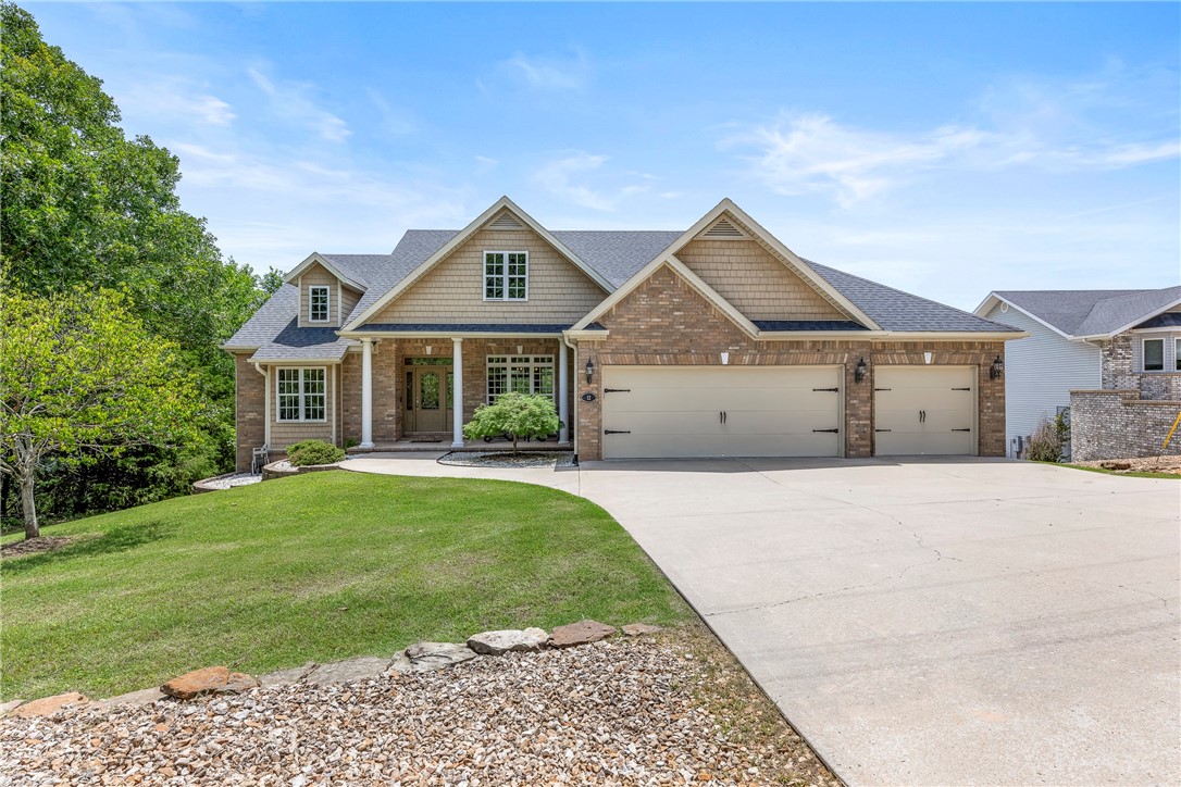 This house has it all! Amazing views, floor-to-ceiling windows bringing the outdoors in, dining room for entertaining, & 3-car garage. Enjoy sitting on your huge covered deck with the treetop view. The kitchen features a spacious nook and an adjoining sunroom, perfect for an office. Solid maple cabinets provide ample storage, and the center island adds extra workspace. The living room boasts a gas fireplace, vaulted ceiling, and a sliding door leading to the deck. The oversized primary ensuite features granite counters, dual sinks, jetted tub, tiled shower & large walk-in closet. Downstairs you will find a fully finished lower level with two large bedrooms, a game room, full bathroom & access to the patio. It also has a bonus room that could function as a bedroom or workshop/hobby room. The game room is plumbed for a future kitchenette/wet bar. Enjoy use of all Bella Vista amenities: rec centers, 7 lakes, 3 pools, & 6 golf courses. Conveniently located near Scottsdale golf course & only a 5-minute drive to HWY 71.