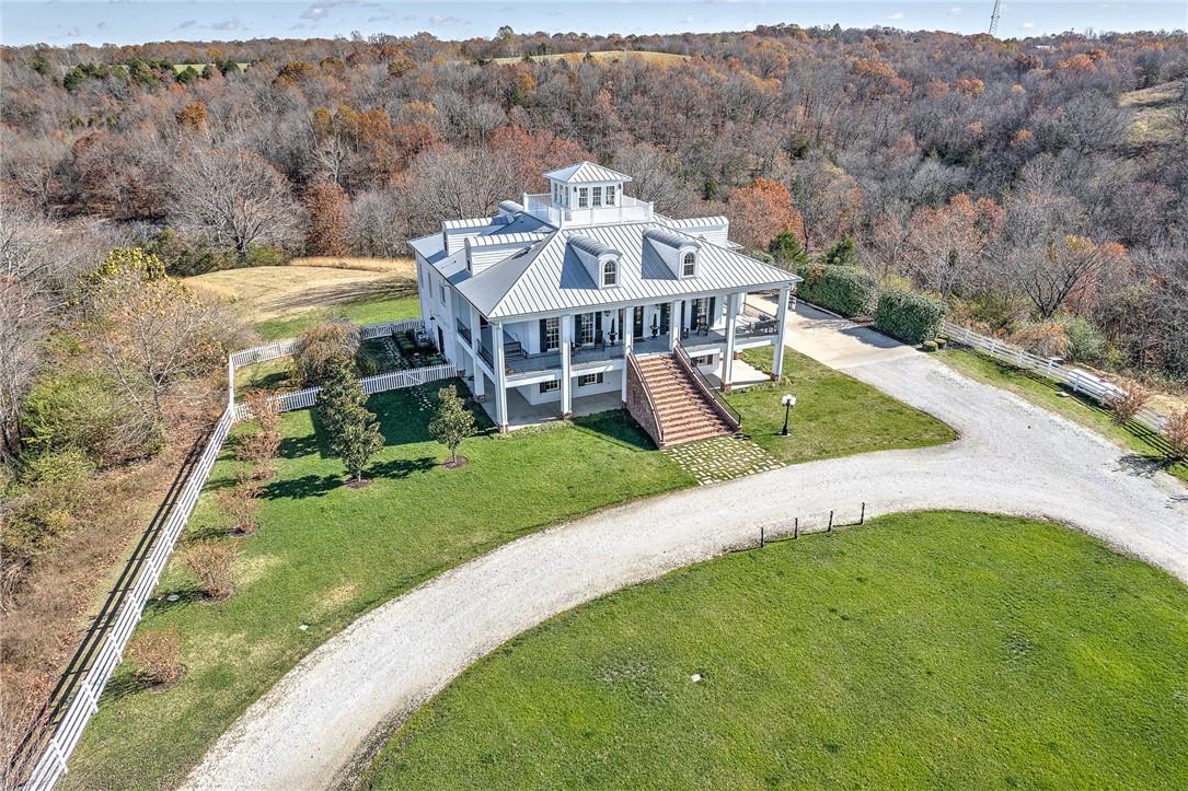 Remarkable Equestrian Estate Property, with pristine barn and indoor riding arena, on the lake!
The 7,119 sq foot house is classic southern style, with a fabulous home theater, which will provide so many options for family or guests. The two impeccable living areas are both cozy and inviting. Lovely finishes in all bathrooms and a chefās kitchen including top line appliances, beautiful details and built ins. The bedrooms are bright, roomy and boast so much character. The top room is the cherry on top; beautiful sun filled room with view of the property and beautiful Beaver Lake. The house is flanked with porches and balconies for outdoor enjoyment and relaxation on this GEM of a property. This is an absolute must see for anyone desiring a private and gorgeous property to ride on and live peacefully.