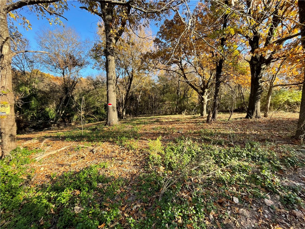2.35+/- acres in an awesome W Springdale location. This property offers a great building location with mature trees for privacy. Water tap has been paid