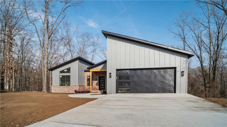 Welcome to your brand-new home at 43 Cawood in Bella Vista! Built by Christopher Hayes Homes, this thoughtfully designed new construction offers 1,858 heated square feet, 3 bedrooms, 2 full baths, and a 2-car attached garage—all on one level. Situated on a .34-acre lot, the home features a desirable split floor plan and a spacious main living area perfect for entertaining. The kitchen is beautifully appointed with granite countertops, pantry, LED lighting, and modern finishes that blend style and function. Walk-in closets, washer/dryer connections, and quality craftsmanship throughout add comfort and convenience. The exterior showcases classic brick, architectural shingles, a covered patio, and concrete driveway. Enjoy peaceful surroundings while still being minutes from Bella Vista’s golf courses, lakes, biking trails, dining, and shopping. Anticipated completion April 1, 2026.