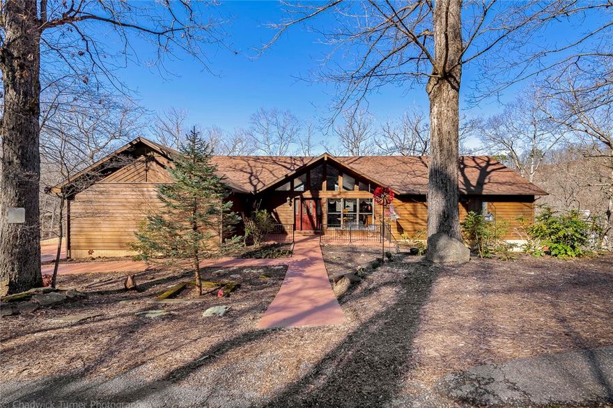 Welcome to lake life living. This is your opportunity for a private oasis on Beaver Lake just minutes from the dam. Home is located at the end of the cul-de-sac with a private 2 slip boat dock inclusive of 2 10X26 boat slips, swim deck, and storage lockers. The dock is also grandfathered in with power. 
This one-owner custom-built home sits on nearly 6 beautiful acres with a wet-weather waterfall, gorgeous lake views, 3 levels of decking, and a gazebo for all your gatherings. 
Additional features are a huge walk-in pantry, large bonus room, 2 sunrooms (one is equipped with a sink and could be a greenhouse),  wired for hot tub, partial home generator, outhouse, and a nice moderate walk to the water and dock. To tempt you further, the home is well maintained, the roof is just a couple of years old, as well as one of the HVAC units.