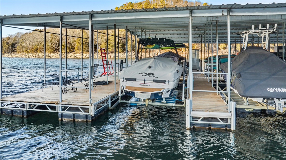 MOTIVATED SELLER!
Picture it: Beaver Lake 2026.
You wake up in your newly built home on the incredible 1.55 acre lot you purchased in 2025. You look out at the gorgeous, expansive view over the lake and pinch yourself. You ponder your options:
Do you hit the lake from your boat thatās waiting in the boat slip that conveyed with the lot? Youāre a short ride to Starkey, Hogscald or party cove!
Or go for a swim and float off the community dock in the beautiful, calm deepwater cove?
Do you rent it out for the weekend to recoup expenses? STRs allowed and renters can swim off the shore or put a boat in at Big Clifty ramp, 5 min away!
Do you travel down the road for a fun afternoon in downtown Eureka Springs? Itās a gorgeous little paved drive.
Or visit with your lovely (but not too close) neighbors and take a golden hour cruise? Thereās a great mix of full-time and part-time residents, adorable cabins and larger upscale homes.
The possibilities are endless and you really have to see it for yourself!