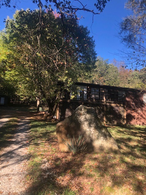 Affectionately referred to as The Hummingbird House, this country haven has an organic garden area,
mature fruit producing cherry, apple and pear trees. Stone fire pit and picnic table for out door dining .
2 yr old roof, gutters, central heat and refridgerator. Hot tub, washer, dryer and refridgerator convey. Property being sold * AS IS * This is a great project for a handyman ! This property is in an RD eligible zone.