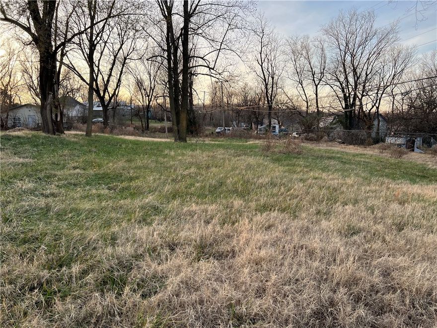 Nice level building lot with utilities available. No Restrictions! Old driveway in place and in the heart of Alpena.  Come take a look today!!