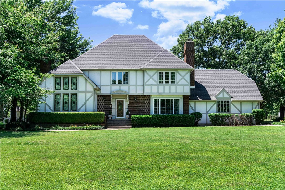 Tudor style home located on 5 park like professionally landscaped acres offers 3 bedrooms, 2.5 bath, 2 living areas, sunroom, bonus room, grand Master suite, in ground pool, 1117sqft guest house, 1704sqft workshop and tree house. Split rail fence around perimeter of property with gated entrance. 2 fireplaces, gourmet kitchen, crown molding, hardwood floors, roll out windows & much more. Custom tree house is a must see! Guest house would make perfect mother-in-law quarters. You won't find anything quite like this! New roof in 2019, and 2 HVAC units replaced in Oct 2021.