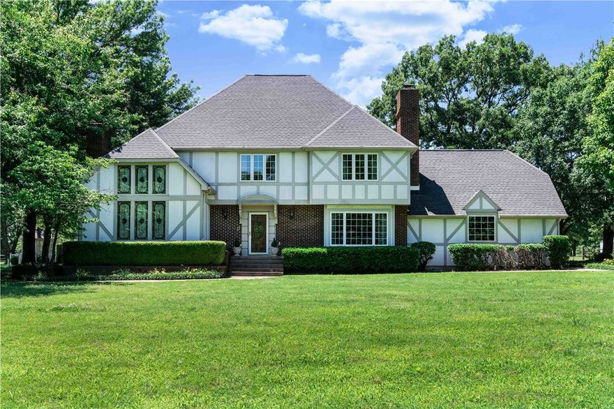 Tudor style home located on 5 park like professionally landscaped acres offers 3 bedrooms, 2.5 bath, 2 living areas, sunroom, bonus room, grand Master suite, in ground pool, 1117sqft guest house, 1704sqft workshop and tree house. Split rail fence around perimeter of property with gated entrance. 2 fireplaces, gourmet kitchen, crown molding, hardwood floors, roll out windows & much more. Custom tree house is a must see! Guest house would make perfect mother-in-law quarters. You won't find anything quite like this! New roof in 2019, and 2 HVAC units replaced in Oct 2021.