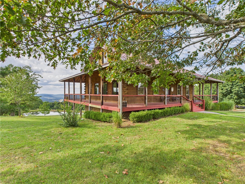 Discover the beauty of the Ozarks with this charming 3-bedroom, 2 full bath, and 2 half bath home, with over 2,100 sqft of finished living space. Nestled on 9.95 parklike acres boasting breathtaking views and a peaceful setting. The open floorplan features a spacious main living area with a wraparound covered porch perfect for relaxing and taking in the scenery. The third bedroom is a cozy non-conforming loft space, while the expansive walkout basement offers a huge workshop, a two-car garage, and potential to finish additional living spaceāincluding a possible bedroom and a convenient half bath. Outside, the manicured acreage includes a serene pond and the beginnings of a guest house alongside it, ideal for future expansion. With its blend of comfort, functionality, and natural beauty, this property offers the perfect balance of privacy and convenience, located just minutes from the Buffalo National River and Parks.