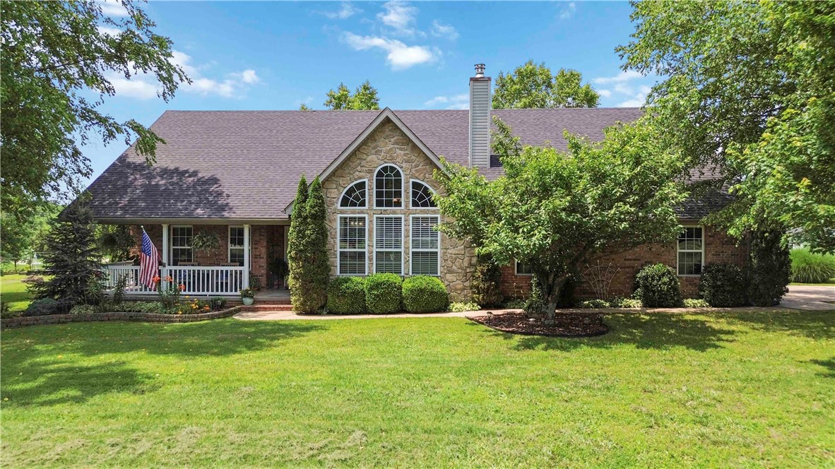 Welcome to your dream retreat! This spacious and well-maintained 4 bedroom, 3.5 bath home sits on 5 beautiful acres, open and inviting layout with designated office space - ideal for remote work or study. Enjoy a wood-burning fireplace with a newly custom-built mantle, heated/cooled sunroom, perfect for year-around relaxation. New roof and HVAC in 2024. All appliances are 5 years old. Beautifully landscaped front and backyard, separate shop building for projects or storage, chicken coop and orchard with fruit trees & raised bed garden, surrounded by spacious land and beautiful nature, perfect for privacy and outdoor enjoyment. This property provides comfort, space, and out in the country without sacrificing modern attributes. The upstairs bedroom furniture can convey. Schedule your private showing and fall in love with this unique property.