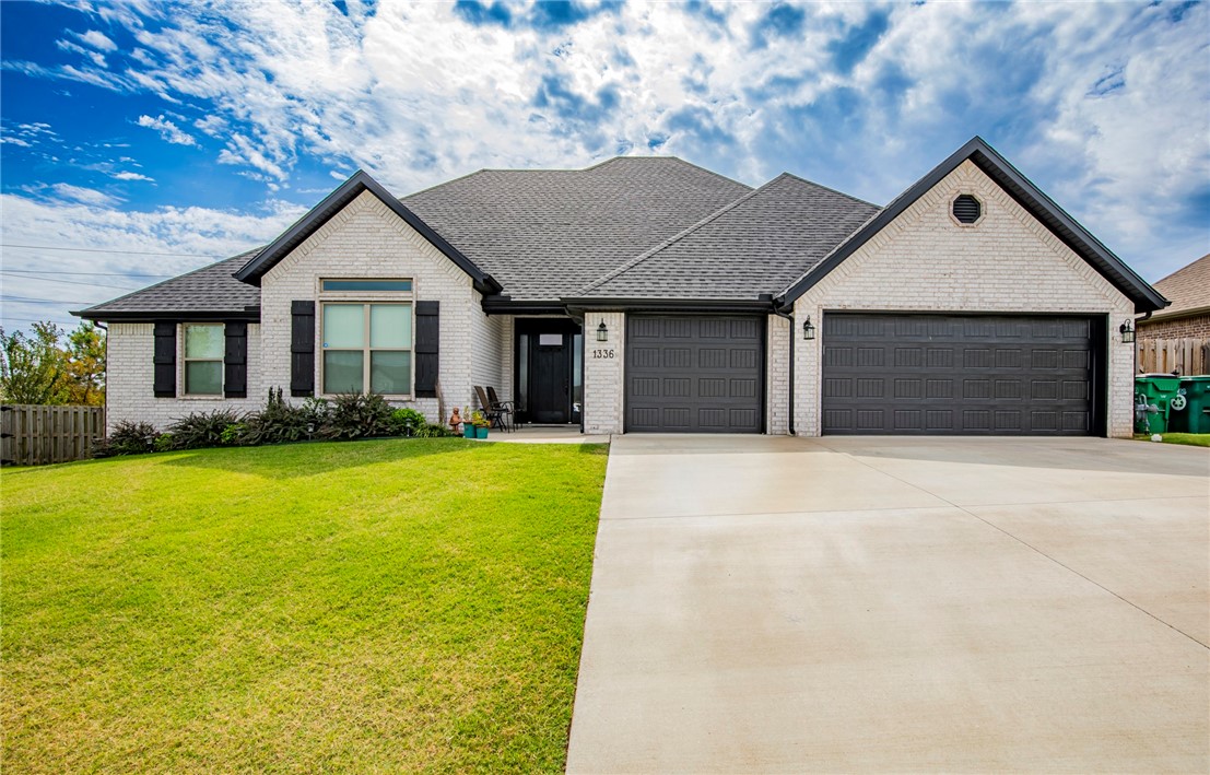 Exceptional, single level home in Tamarron Subdivision. This home is only 2 years old and is in excellent condition. It has a large 3-car garage and maintenance-free all brick exterior. There are granite counters throughout, and vaulted ceilings with a gas log fireplace in the living room. The primary bedroom has a tray ceiling with crown molding, and very large walk-in closet. It has premium plush carpeting that adds warmth and coziness to all the bedrooms, and beautifully tiled floors that are easy to keep clean in all other areas. There's a nice covered back patio, and privacy fenced back yard. This home is very clean and move-in ready. Tamarron is a desirable, well-maintained subdivision that does not have POA/HOA dues. Grimsley Junior High School is very close by. The home is located 7 miles from downtown Bentonville, 8 miles from Hwy 49, and it's only a 12-minute drive to XNA airport.