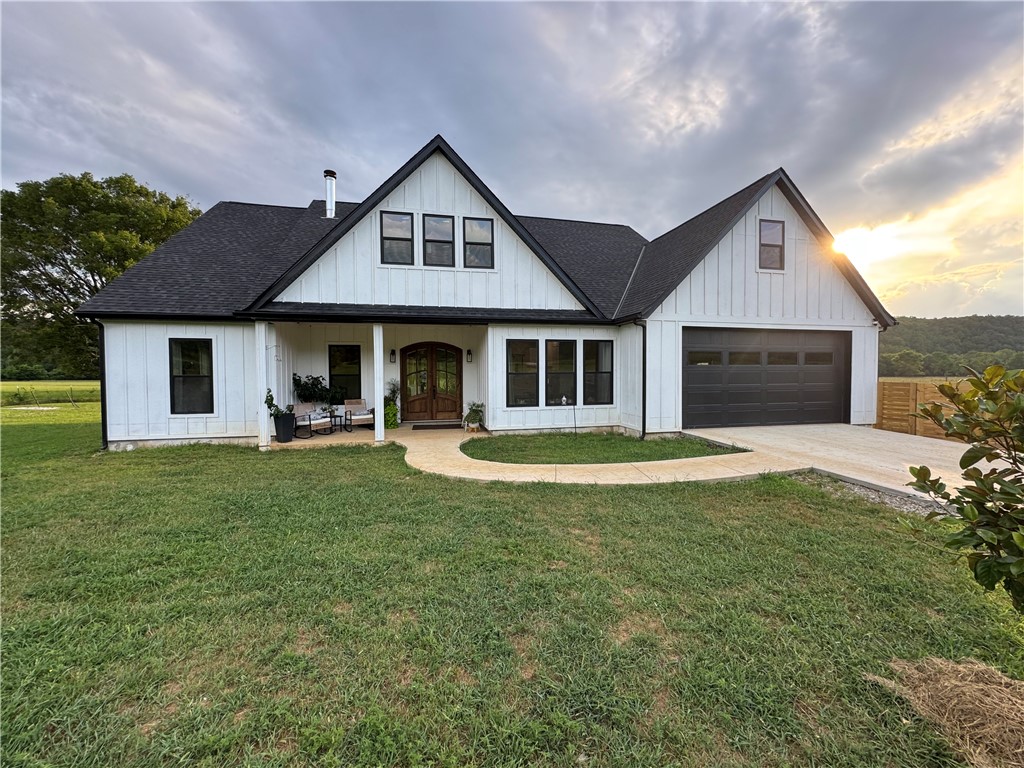 Charming custom built home less than a year old nestled on 31+/- acres with a lot of War Eagle Creek frontage. Located just 10 miles south of Huntsville with Highway frontage. A lot of love and thought went into building this beautiful Farm Style home. Plenty of room for animals, garden, homesteading, etc.... This place even has a small pond with room to expand and a detached metal shop for your projects or storage. Don't miss this opportunity to own this beautiful piece of the Ozarks.