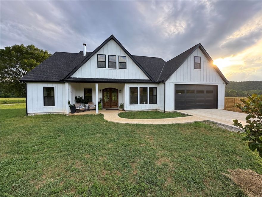 Charming custom built home less than a year old nestled on 31+/- acres with a lot of War Eagle Creek frontage. Located just 10 miles south of Huntsville with Highway frontage. A lot of love and thought went into building this beautiful Farm Style home. Plenty of room for animals, garden, homesteading, etc.... This place even has a small pond with room to expand and a detached metal shop for your projects or storage. Don't miss this opportunity to own this beautiful piece of the Ozarks.