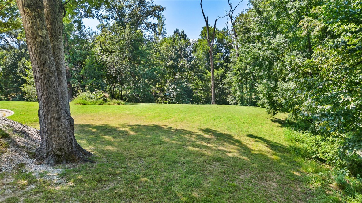 Premier estate-size .84-acre lot in the prestigious gated Pinnacle Country Club. Nestled in a quiet cul-de-sac with mature, tree-lined surroundings, this exceptional property offers privacy and a serene setting. The only vacant lot currently for sale in this sought-after community—an opportunity you won’t want to miss. Ready for your dream home—minimum 3,500 sq ft build—with utilities on site and a completed survey. Located in the highly acclaimed Bentonville School District, this lot combines exclusivity, convenience, and natural beauty.