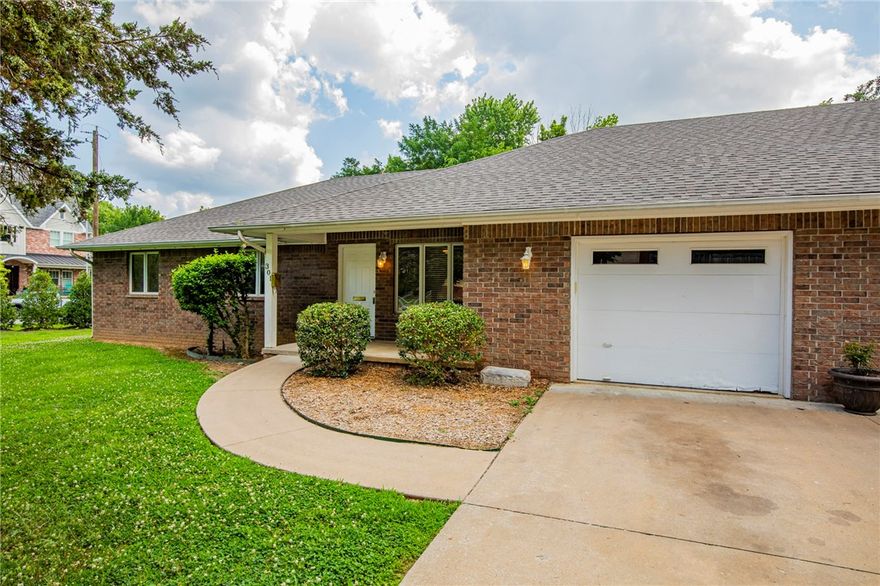 Awesome location close to Downtown Bentonville!!! Well maintained 3 bedroom 2 bath duplex has formal living room and open dining room/great room kitchen, large pantry, extra storage in the utility room. Covered patio, fenced yard, 1 car garage and additional storage building in back yard. Yard care is included.