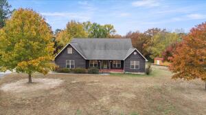 Cedar Elegance, Inside & Out! Discover a timeless haven in Arkansas on 1.45 acres where classic & rustic elegance harmoniously merge in a 3100-square-foot home. This charming residence boasts 4 generously-sized bedrms, 3 full baths, an office, & a formal dining room, creating an inviting & spacious atmosphere that combines both comfort and style.As you step inside this home, the first thing that captures your attention is the captivating cedar beams that grace every corner. These beams not only add a touch of character and warmth to the interiors but also create a connection to nature, enhancing the ambiance. The 10-foot ceilings throughout the home bring a sense of openness and grandeur, allowing the natural light to embrace every nook, creating a warm & inviting atmosphere. $439,900