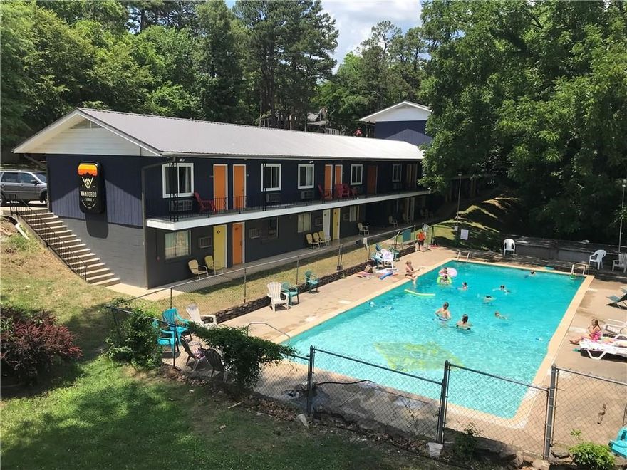One of the newest renovated boutique motels in Eureka Springs. This turn-key motel has a lot to offer including the largest outdoor salt water pool in Eureka Springs, an incredible restaurant and bar, 35 rooms, and 3 historic cabins with the possibility of adding more cabins. Located minutes from downtown Eureka Springs which the historic trolley route right out front, some of the best rivers Arkansas has to offer, mountain biking trails and more.