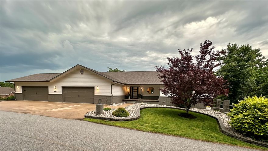 130K Price Improvement! Experience ultimate privacy and breathtaking year-round Beaver Lake views from nearly every room in this stunning home! Relax on the 960 sq. ft. covered upper deck with a hot tub or the 775 sq. ft. covered lower deck. Just 2 minutes from the Beaver Lake beach and boat ramp and 8 minutes to Prairie Creek Marina, with an oversized 4-car garage—no need for a boat slip!

Inside, this updated home offers a seamless layout with spacious rooms. Each level features a master suite, family room, and wet bar, perfect for entertaining or multi-generational living. The gourmet kitchen boasts spectacular lake views, complemented by large bedrooms, a weight/theater room, and a generous laundry/pantry/mudroom.

Built on a solid concrete foundation, updates include a new roof, stained concrete floors, remodeled bath, new appliances, fresh paint, updated fixtures, gutters with leaf screens, a new outdoor staircase, professional landscaping, and more. Don’t miss this exceptional lake retreat!