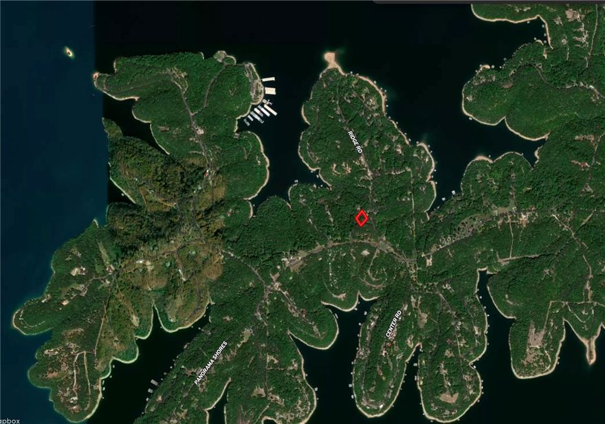 Views, Views, Views! Come build on this double lot on E Center Rd in the Mundell Heights community of Beaver Lake. Here is your opportunity to own a property with phenomenal views of Beaver Lake. There is a public boat ramp down the road at Starkey Marina. There is a public waterline running the road. Builders opportunity.