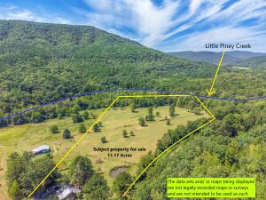 THIS PROPERTY BORDERS LITTLE PINEY CREEK & THE NATIONAL FOREST! The rare possibility that you find a cabin with Fiber internet and so close to so many off road riding trails. With over 10 Acres of gorgeous rolling fields and most of the property is fenced and cross fenced including a small pond. This property will not last long. Schedule your showing today.