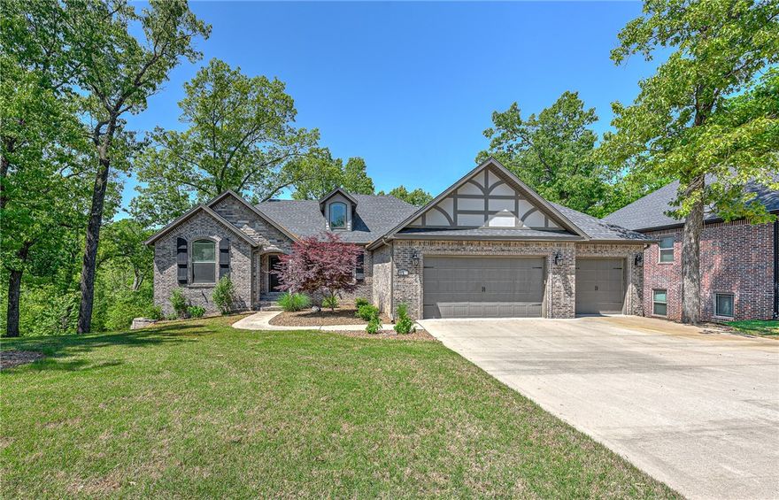 Showstopping home in a prime location in Bentonville! Minutes from the new Walmart campus, Downtown Bentonville, the MTB & Greenway trails, & quick access to I-49. Versatile home w/ master suite & office (or use as a BDR) & full bath on main floor. Downstairs is finished w/ 9' ceilings & featuring 2 BDRS + full bath & 1 BDR w/ an en suite bathroom. The secondary living room has a wet bar & tons of added storage. Media room w/ equip to convey & workout room. Stunning master shower w/ dual entry, dual shower heads, & dual corner seats. Not to mention your soaker tub awaits you after a long day of work. Lovely white cabinetry in the kitchen w/ gas cooktop, stainless steel appliances, granite countertops, island for prepping, central vac, huge pantry, fireplace, & bartop seating. Overlook the beauty that is Arkansas as your home will backup to the woods w/ no neighbors behind you. Woods Creek has walking trails, neighborhood pond, pool, playgrounds, & basketball courts. Bentonville schools too!