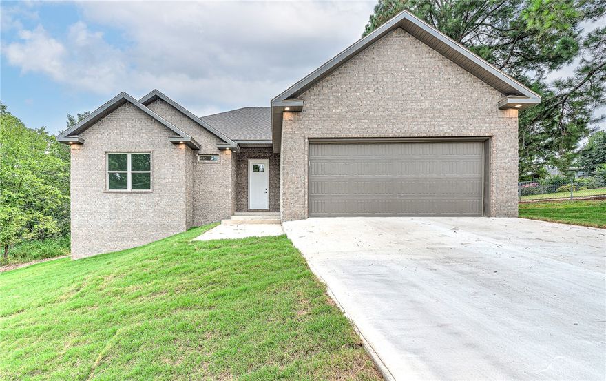 Up to $5000 of Preferred Lender Credit Available! Welcome to 94 Sherlock Drive, a stunning new construction home in the heart of Bella Vista. This 3-bedroom, 2-bath residence offers a modern open-concept design with high ceilings, abundant natural light, and stylish finishes. The kitchen is equipped with granite countertops, custom cabinetry, and a seamless flow into the dining and living spaces—perfect for gatherings and everyday living. The primary suite boasts a spa-inspired bath and walk-in closet, while two additional bedrooms provide comfort and flexibility. Outside, the covered deck overlooks a tree-lined backyard, creating the perfect spot to relax or entertain. Nestled near Bella Vista’s scenic trails, golf courses, and lakes, this brand-new home combines modern comfort with Northwest Arkansas’s natural beauty.
