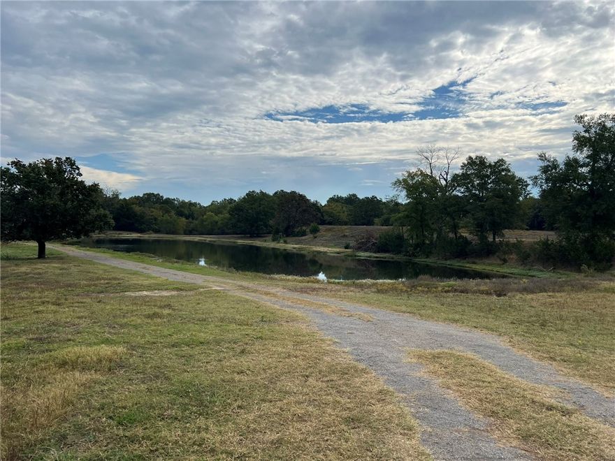 21 Acres | 1,800 Sq. Ft. Shop | Pond | Utilities On Site | Development Potential
Versatile 21-acre tract just 20 minutes from downtown Fort Smith. This level, open pasture features mature oak trees, a 2-acre stocked pond, and a working corral—perfect for livestock, recreation, or building your dream estate. The 1,800 sq. ft. insulated shop includes a bathroom and private office, offering flexible use for operations, storage, or a barndominium conversion. Water, electric, and septic are already on site, saving time and cost. Whether you're looking for a hobby farm, private ranch, or future residential development, this property delivers function, beauty, and investment potential. With its peaceful setting and proximity to city amenities, it’s an outstanding opportunity in a growing area.