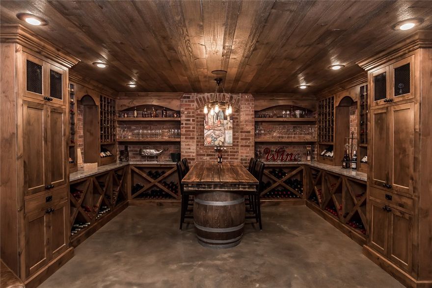 Amazing home in Downtown Bentonville! This home is made for entertaining, featuring large and open living spaces, multiple outdoor spaces, wine celler, bonus room, and outdoor kitchen! Lots of curb appeal with spacious front porch and landscaped yard. Gorgeous features throughout the home include wood beams in living room, built-ins, stained concrete floors, stained glass front door & transom, and more! Foyer entry with hardwood floors throughout living spaces. Office off the entry has french doors and large window. On the other side of the entry is large formal dining. Spacious kitchen has granite tops, farmhouse sink, gas range, and pantry. Living room is open to kitchen and has built-ins and brick fireplace. Downstairs is a gorgeous wine cellar, beautiful wood details and brick details and plenty of space for entertaining! Master suite is a true retreat with large attached bath, walk-in shower & tub, plus a private deck with built-in hot tub. This home is an absolute MUST SEE!!